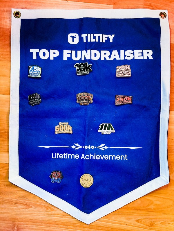 The Tiltify Top Fundraiser banner and pins
